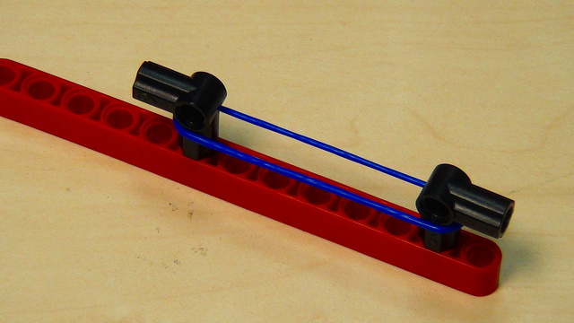 Image for Rubber bands - LEGO robot attachment triggered with a motor - part 2 removing the motor